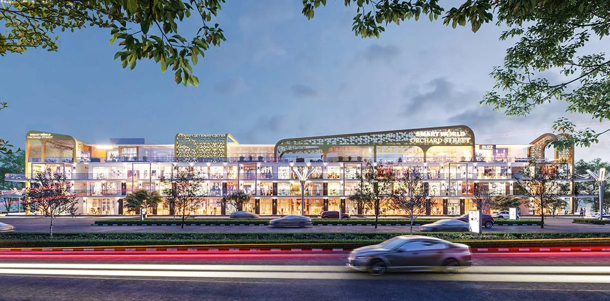 Smartworld Orchard Street high-street retail frontage lit at night, Sector 61 Gurugram